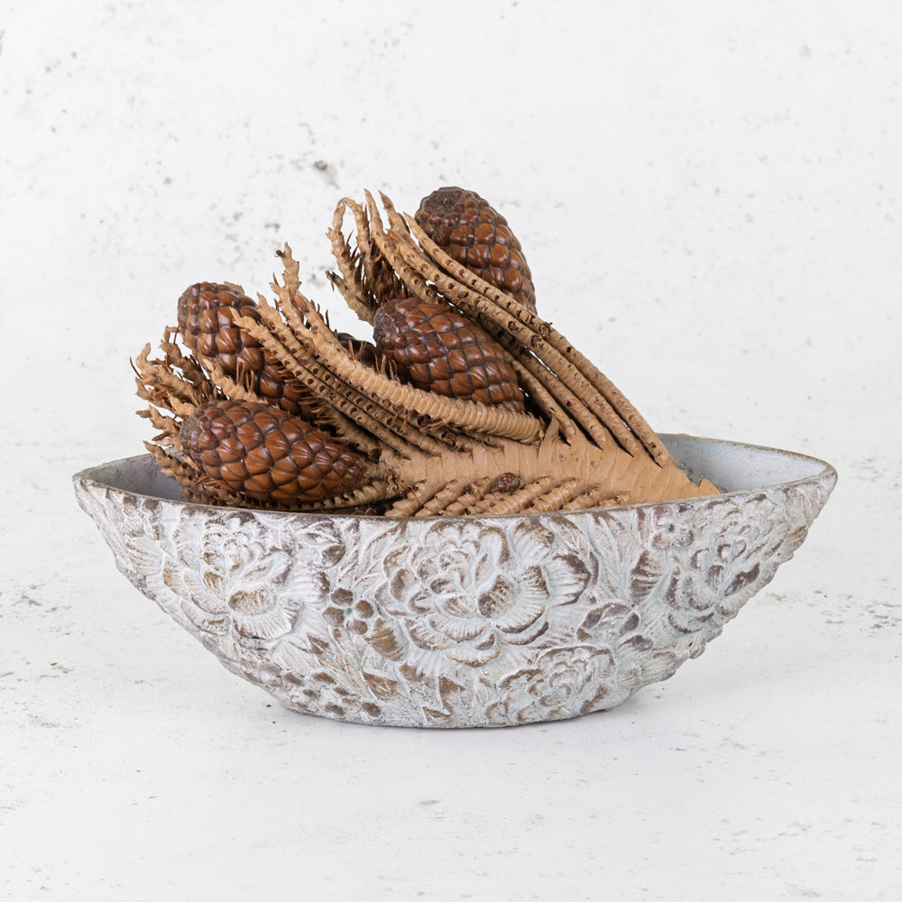 Tika Twigs with Pods in a flower patterned stone bowl