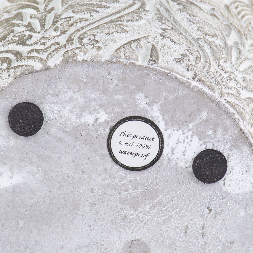 Not waterproof label on base of baroque pots