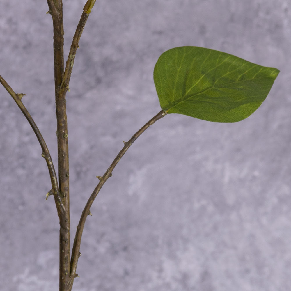 A single faux bougainvillea spray in an acidic red-orange colour