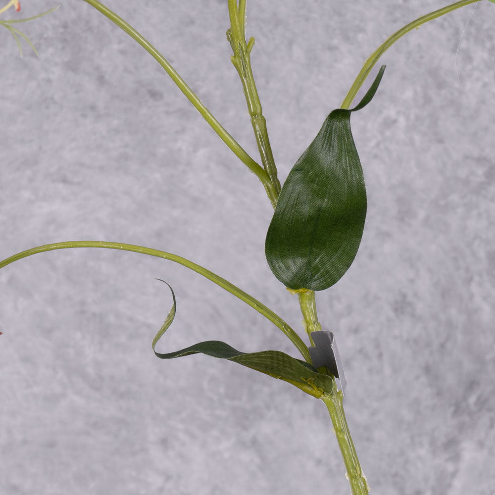 A close up of the foliage from a faux gloriosa spray