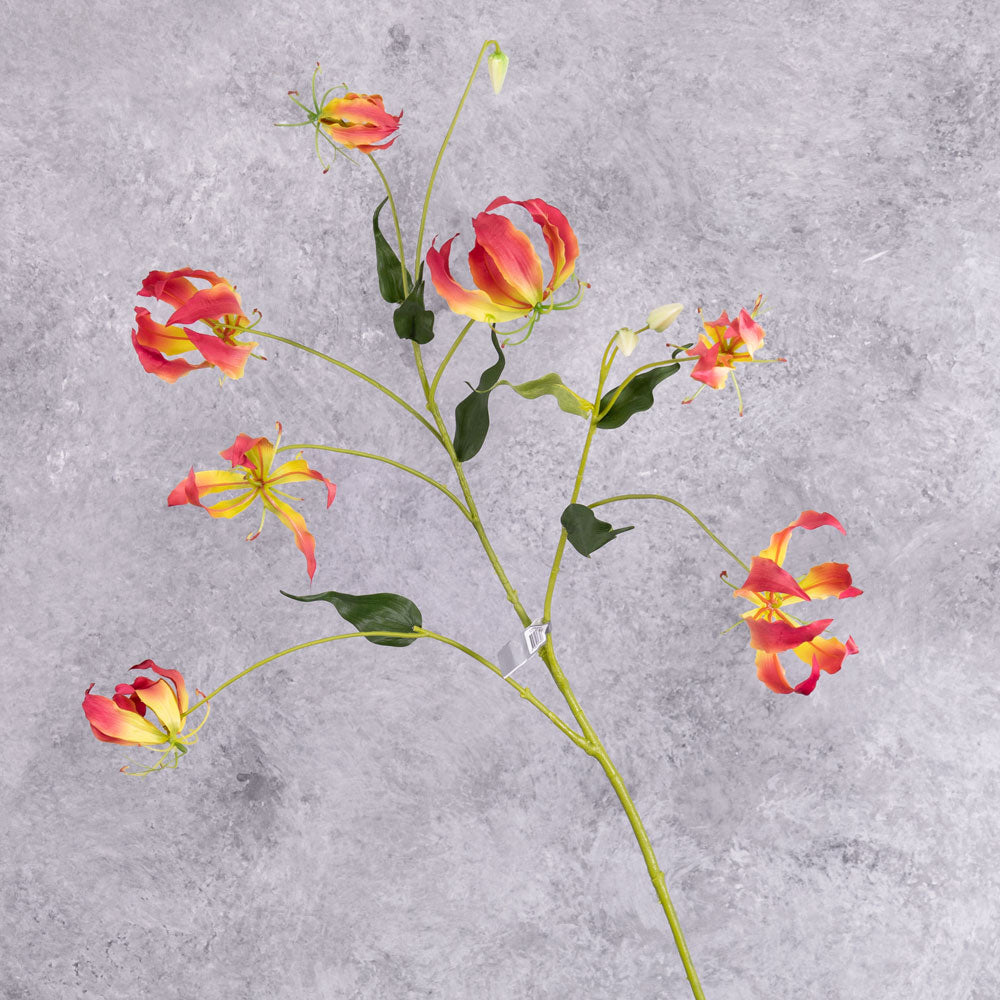 A faux pink and yellow coloured Gloriosa spray
