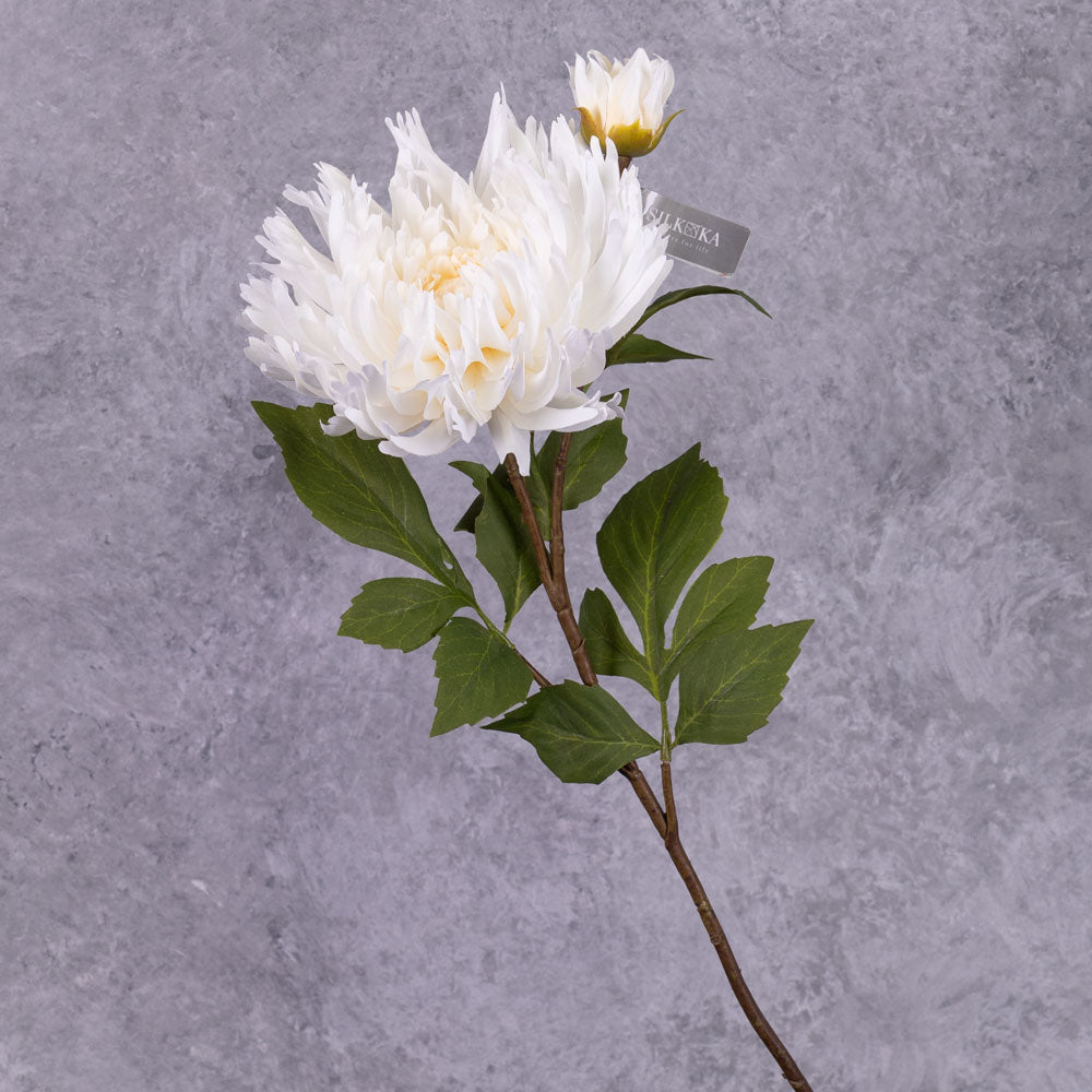 A faux chrysanthemum spray with off-white flower and emerging bud, plus generous green leafy foliage