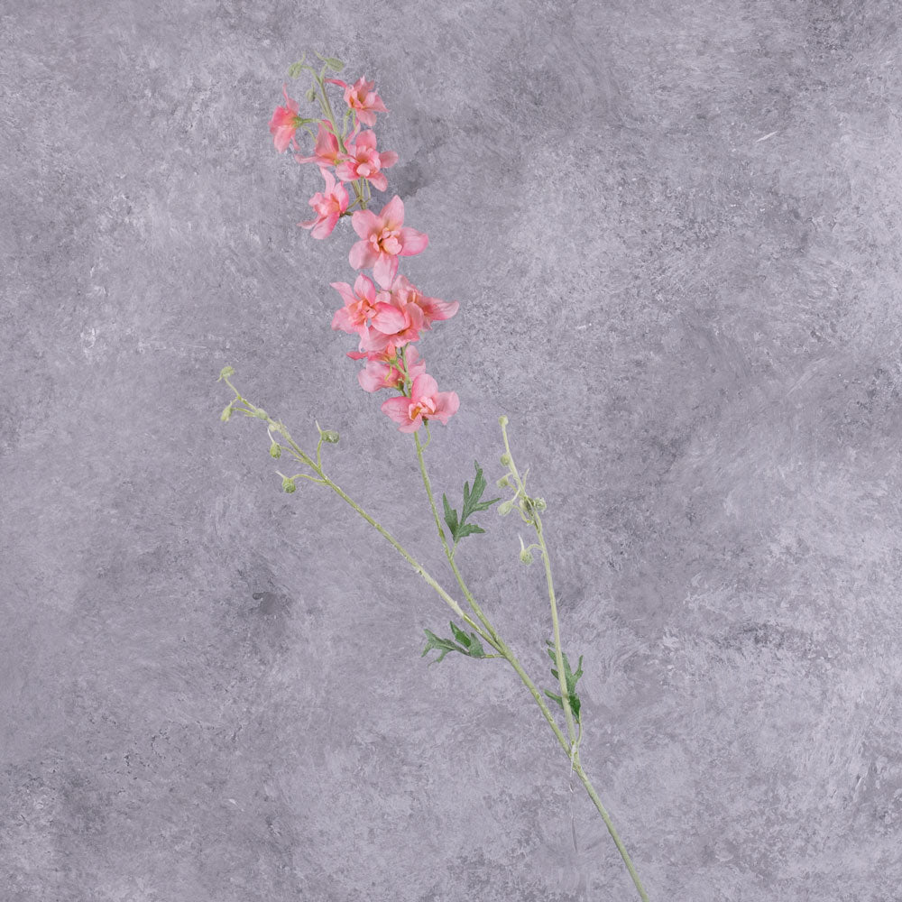 A tall faux delphinium with pink flowers