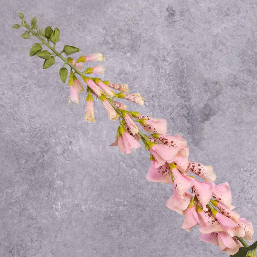 A close up of faux, pink foxglove flowers
