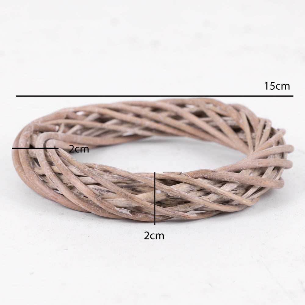 A small, natural-coloured wreath made from twisted wicker stems